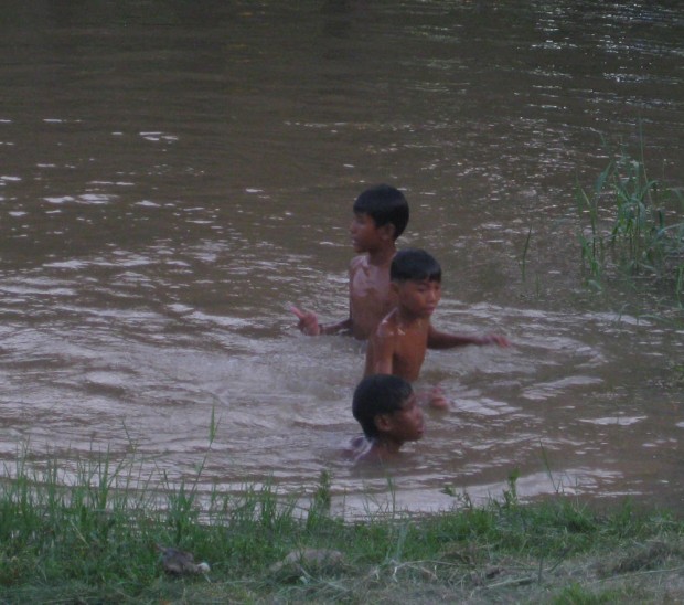 These boys are multitasking: washing, cooling off, and having a great time! But take a look at the next photo too.