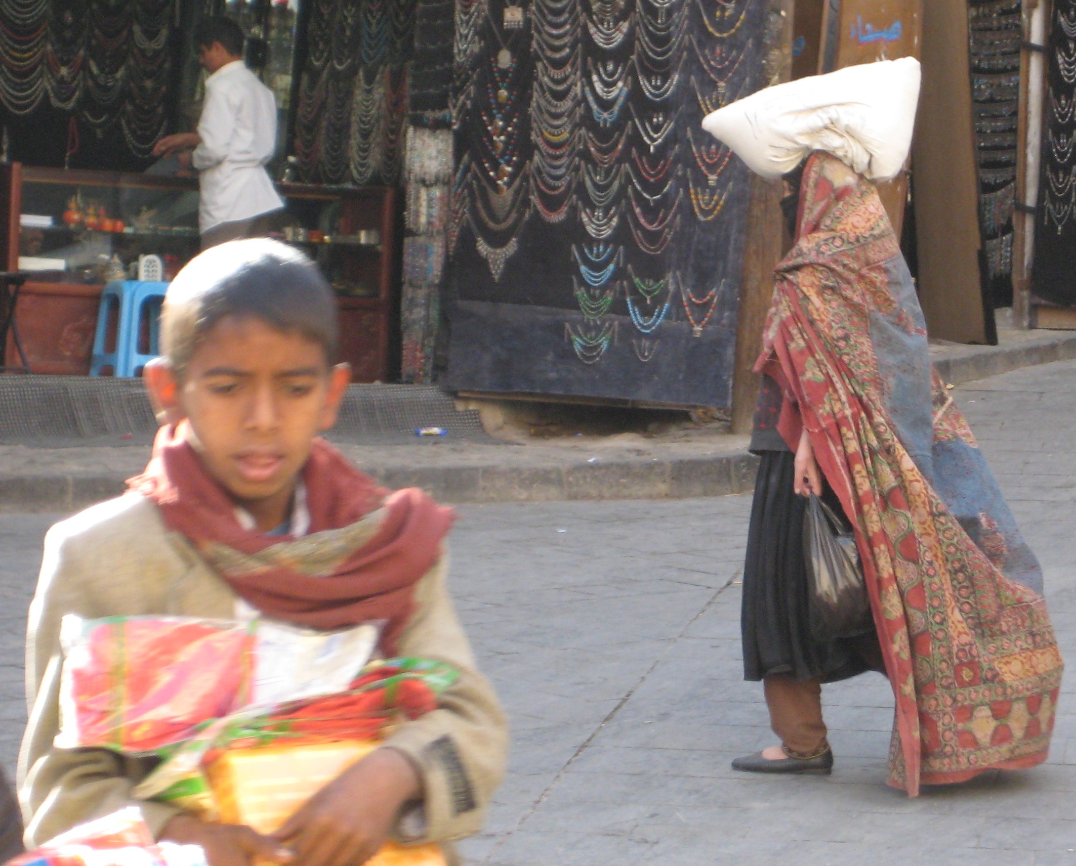 blog 62-Yemen woman and boy carrying food